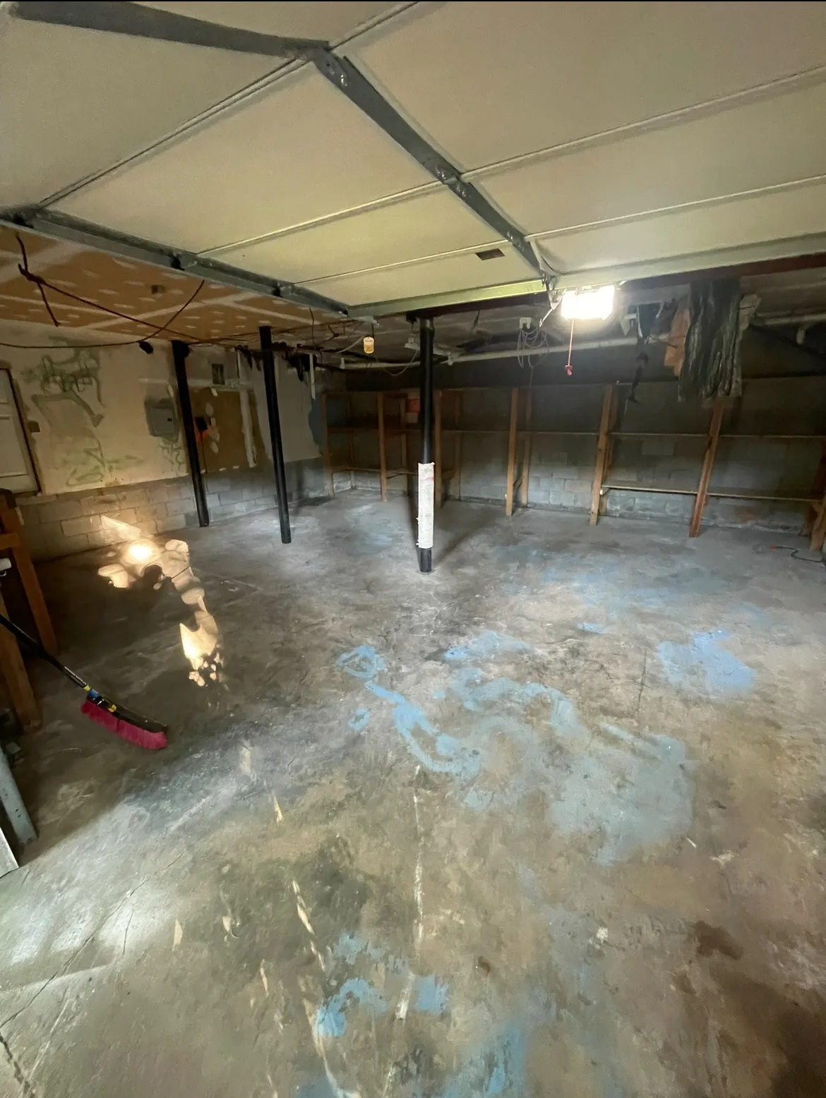 Reclaimed and cleaned basement space, swept after junk removal